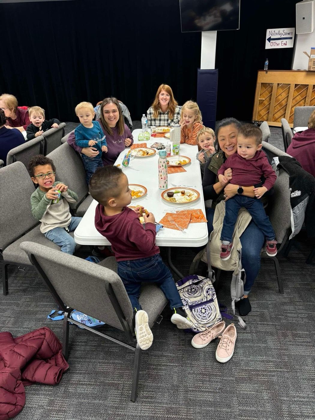 Families sharing a meal together at a school celebration