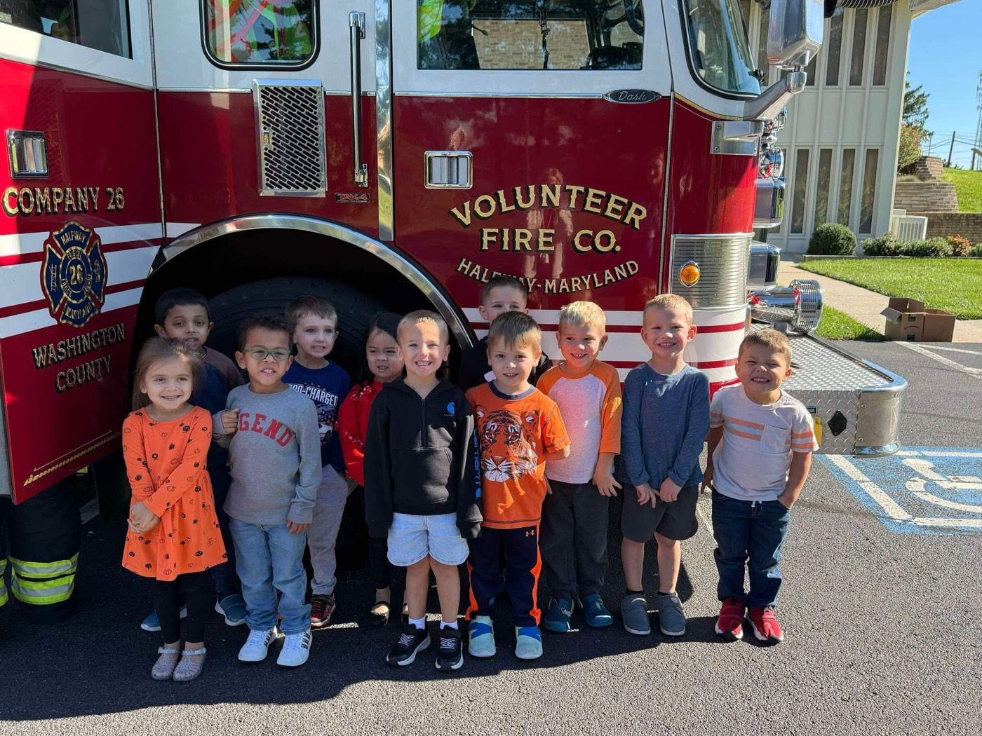 The class posing in front of a visiting fire truck from the Volunteer Fire Company